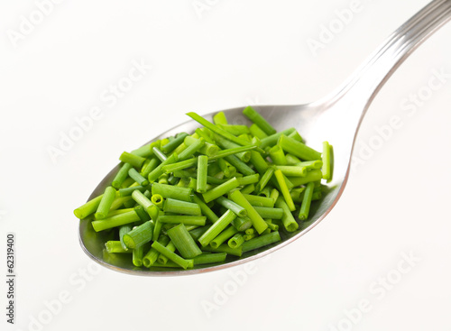 Photo: Chopped chives on spoon Chopped chives on spoon