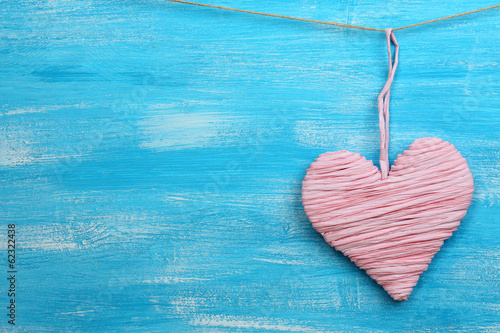 Photo: Decorative heart on wooden background Decorative heart on wooden background