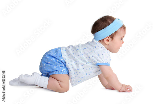 Photo: Cute baby girl crawling isolated on white Cute baby girl crawling isolated on white