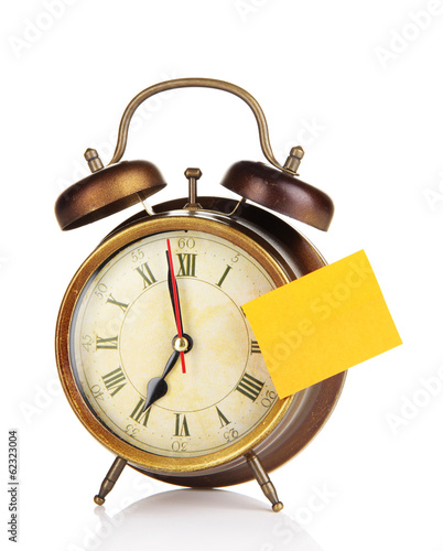 Photo: Alarm clock with sticker isolated on white Alarm clock with sticker isolated on white
