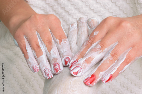 Photo: Feet massage with cream Feet massage with cream