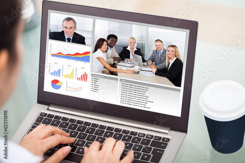 Photo: Businesswoman Video Conferencing With Laptop Businesswoman Video Conferencing With Laptop