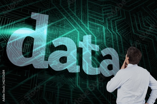 Photo: Data against green and black circuit board Data against green and black circuit board