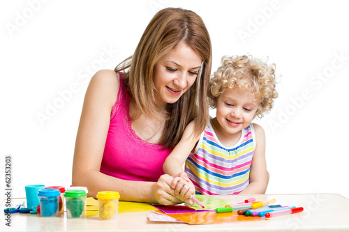 Photo: Mother and kid girl painting together Mother and kid girl painting together
