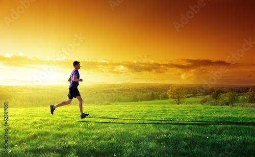Photo: sunset and running young man sunset and running young man
