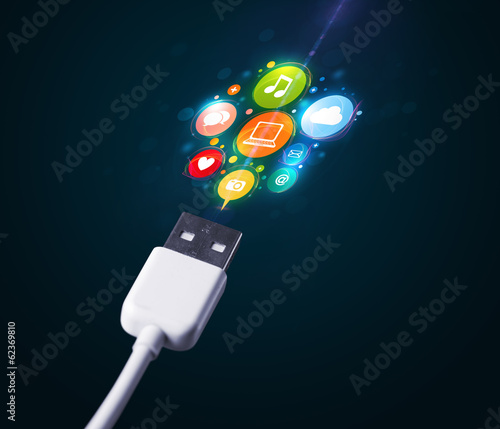 Photo: Social media icons coming out of electric cable Social media icons coming out of electric cable