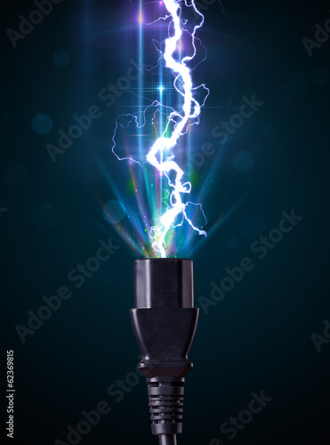 Photo: Electric cable with glowing electricity lightning Electric cable with glowing electricity lightning