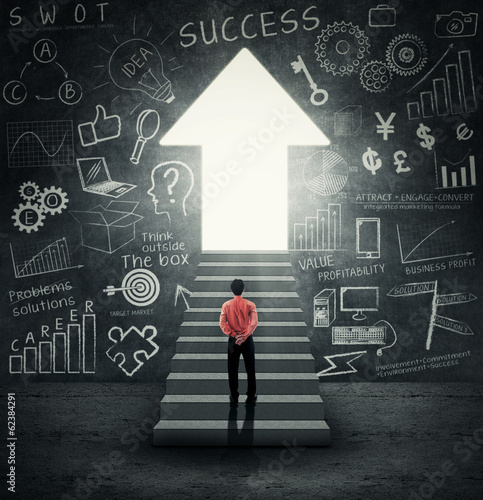 Photo: Businessman walking into an upward arrow door Businessman walking into an upward arrow door