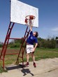 The boy playing basketball The boy playing basketball