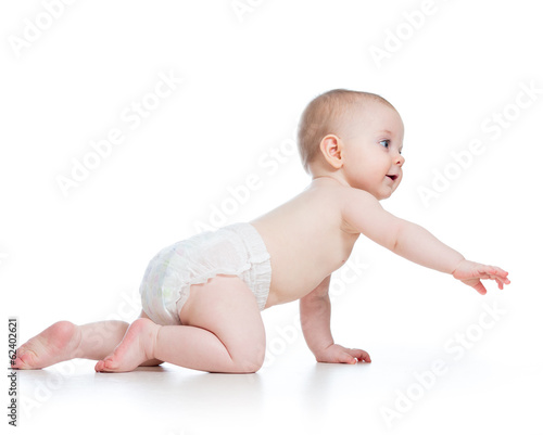 Photo: side view of pretty crawling baby girl side view of pretty crawling baby girl