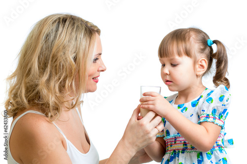 Photo: mother giving milk drink to kid mother giving milk drink to kid