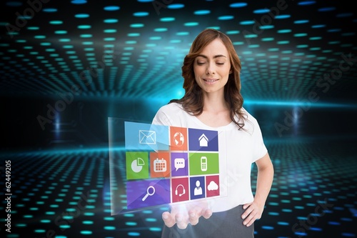 Photo: Smiling businesswoman showing app menu Smiling businesswoman showing app menu