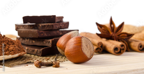 Photo: chocolate, spices and nuts - sweet food chocolate, spices and nuts - sweet food