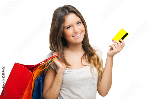 Photo: Woman holding shopping bags and a credit card Woman holding shopping bags and a credit card