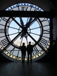 Two people silhouetted by huge clock Two people silhouetted by huge clock
