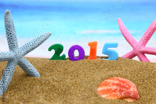 Photo: Multicolored new year 2015 on the beach Multicolored new year 2015 on the beach