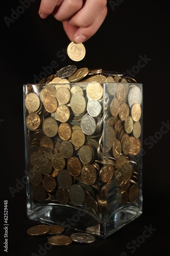 Photo: Coins in a glass jar Coins in a glass jar