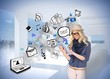 Stylish blonde using tablet pc with app icon doodles Stylish blonde using tablet pc with app icon doodles