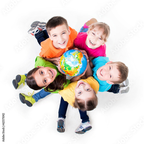Photo: Group of kids sitting on the floor in a circle. Group of kids sitting on the floor in a circle.