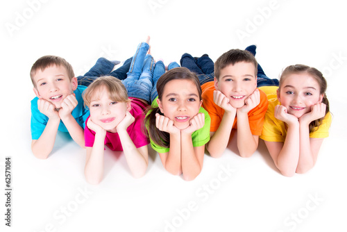 Photo: Five beautiful kids lying on the floor. Five beautiful kids lying on the floor.