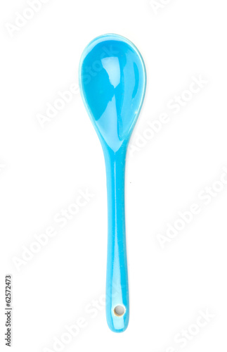 Photo: blue spoon isolated white background blue spoon isolated white background