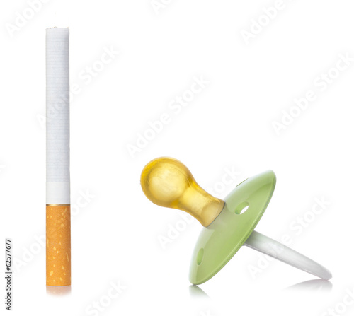 Photo: Concept of smoke with pacifier for babies. Concept of smoke with pacifier for babies.