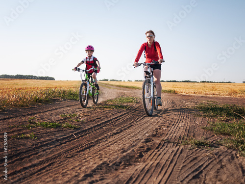 Photo: family cycling in summer family cycling in summer