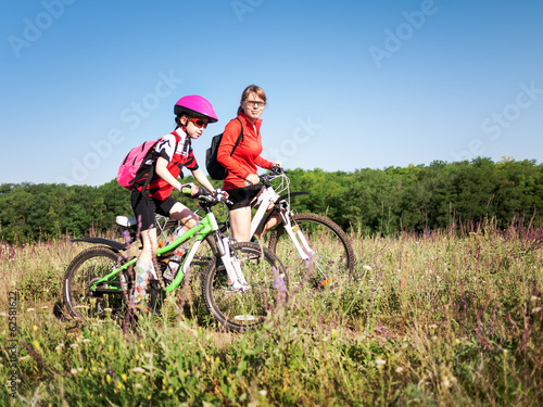 Photo: family cycling in summer family cycling in summer