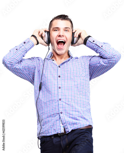 Photo: Attractive young man wearing headphones on white background Attractive young man wearing headphones on white background