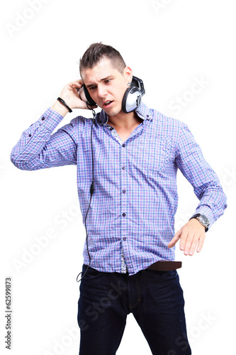 Photo: Attractive young man wearing headphones on white background Attractive young man wearing headphones on white background