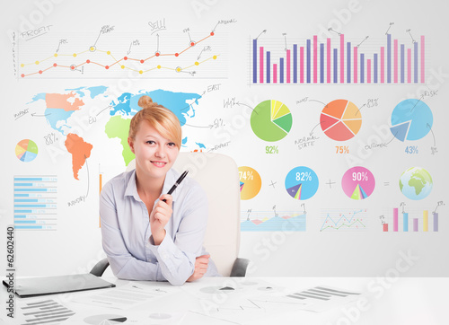 Photo: Business woman with colorful charts Business woman with colorful charts