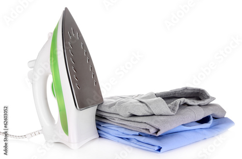 Photo: Iron with shirts isolated on white Iron with shirts isolated on white
