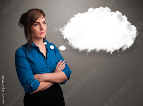 Photo: Pretty lady thinking about cloud speech or thought bubble with c Pretty lady thinking about cloud speech or thought bubble with c