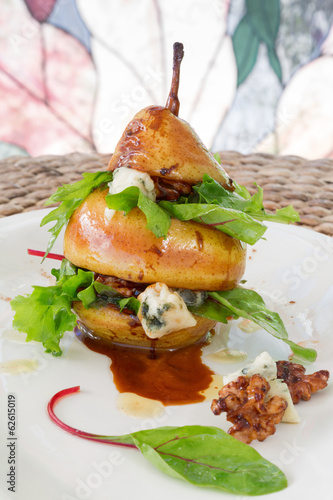 Photo: Vertical composition of pear salad with green leafs, blue cheese Vertical composition of pear salad with green leafs, blue cheese