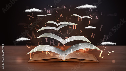 Photo: Pages and glowing letters flying out of a book Pages and glowing letters flying out of a book