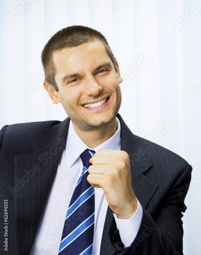 Photo: Happy successful gesturing businessman Happy successful gesturing businessman