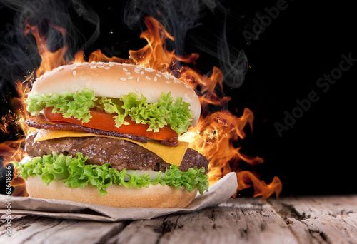  Delicious hamburger with fire flames