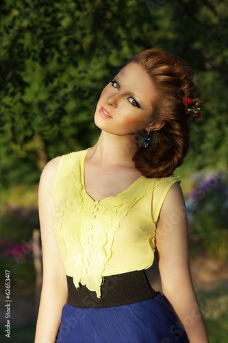 Photo: Cute Romantic Young Woman in Sleeveless Sundress Outdoors Cute Romantic Young Woman in Sleeveless Sundress Outdoors