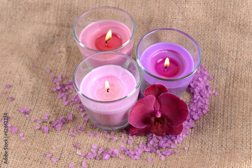 Photo: Composition with beautiful colorful candles, sea salt and Composition with beautiful colorful candles, sea salt and