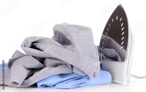 Photo: Iron with shirts isolated on white Iron with shirts isolated on white
