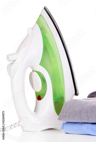 Photo: Iron with shirts isolated on white Iron with shirts isolated on white