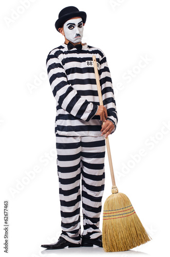 Photo: Prisoner with broom isolated on the white Prisoner with broom isolated on the white