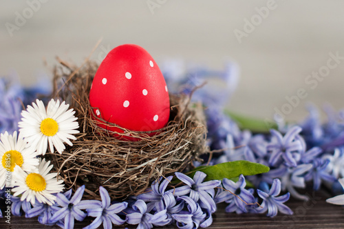 Photo: Red Easter egg in a nest Red Easter egg in a nest