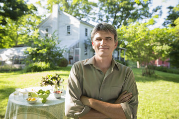 Photo: On The Farm. A Man In A Farmhouse Garden, Beside A Round Table With Fresh Lemonade Drinks. On The Farm. A Man In A Farmhouse Garden, Beside A Round Table With Fresh Lemonade Drinks.