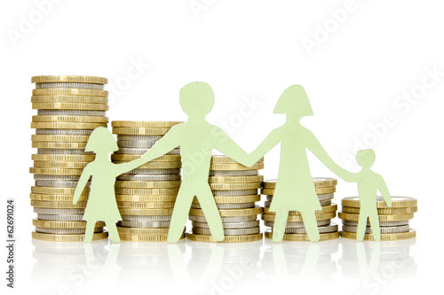 Photo: Paper family and stacks of coins Paper family and stacks of coins