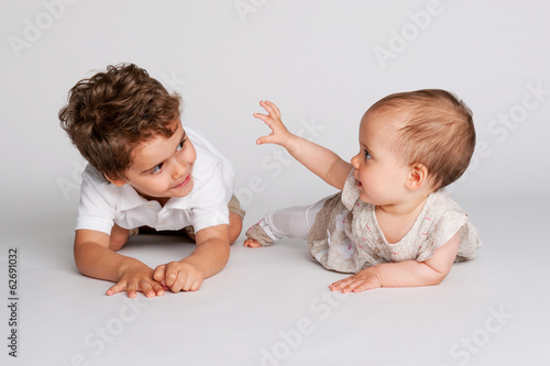 Photo: Baby Girl with Her Toddler Brother. Baby Girl with Her Toddler Brother.