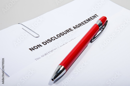 Photo: Non disclosure agreement and pen Non disclosure agreement and pen
