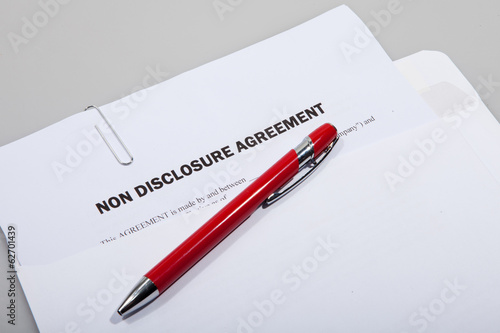 Photo: Non disclosure agreement and pen Non disclosure agreement and pen