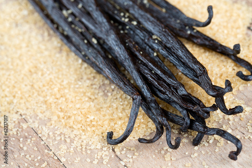 Photo: vanilla pods and brown cane sugar vanilla pods and brown cane sugar