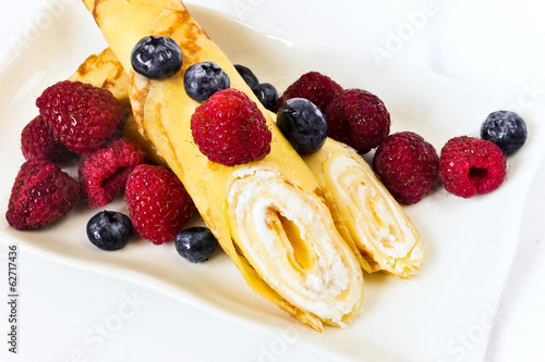 Photo: Delicious pancakes with curd and berries Delicious pancakes with curd and berries